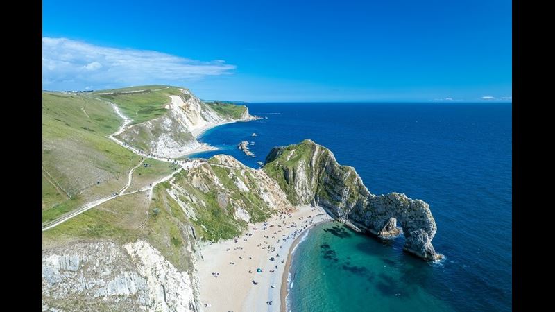 The limestone arch at scenic Durdle Door with clear blue skies