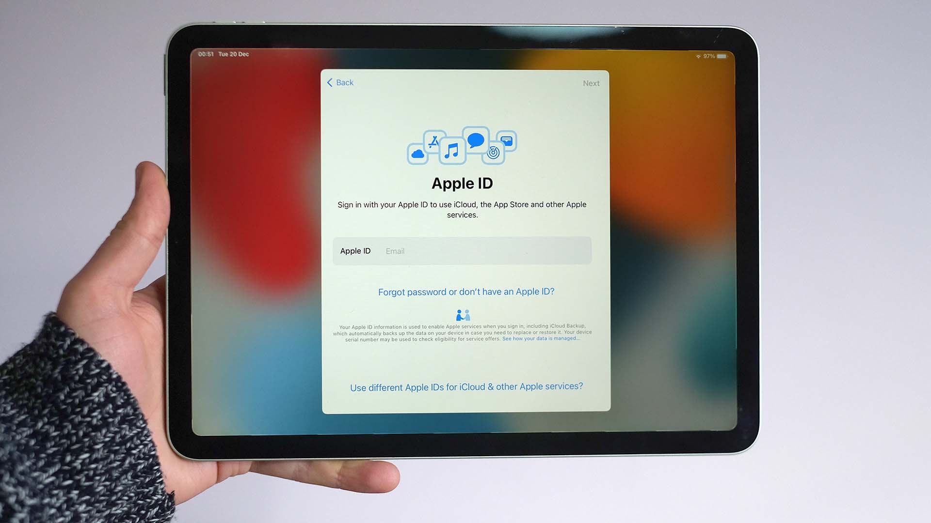 An iPad with the screen showing the Apple ID log in page
