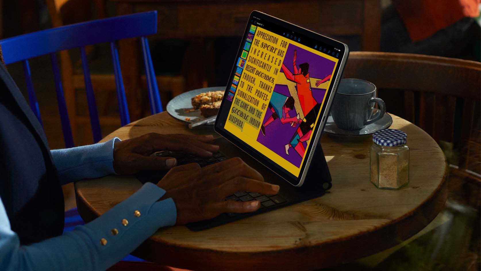 Person using an ipad on a table