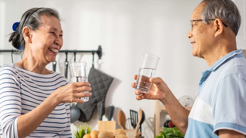 Couple with glasses of water