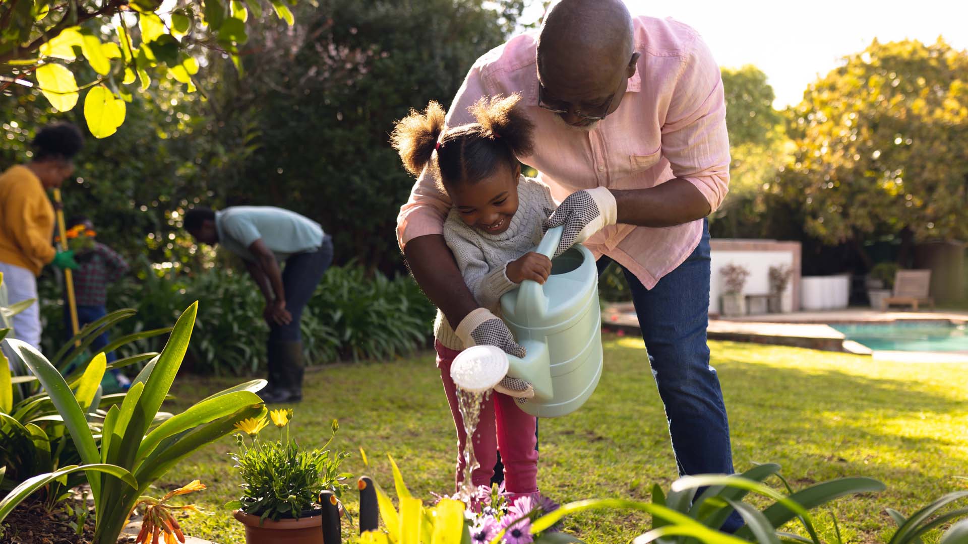 Watering the plants is a great way to wind down (and tiny gardeners can lend a hand)