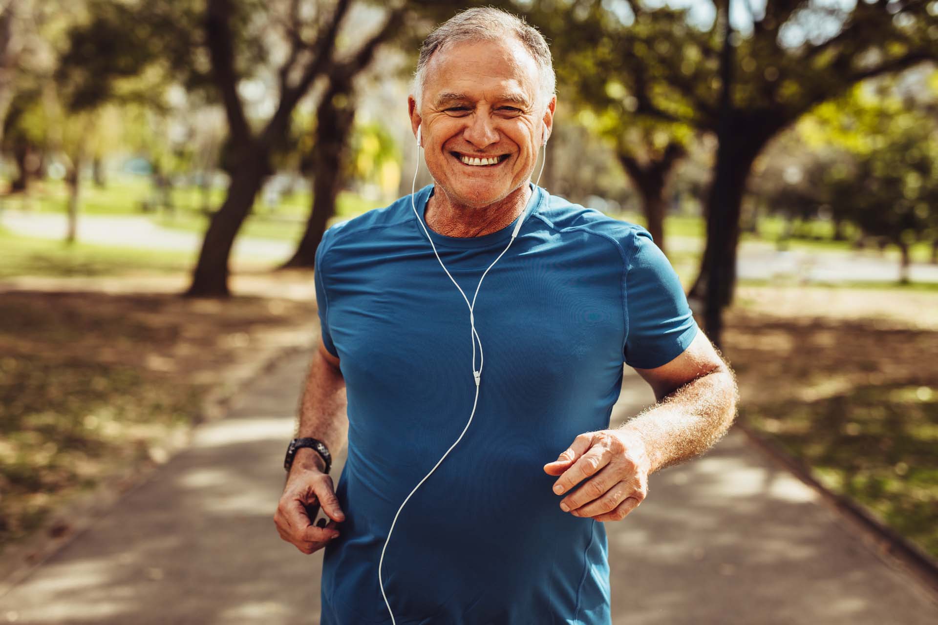 Man running with headphones in his ears
