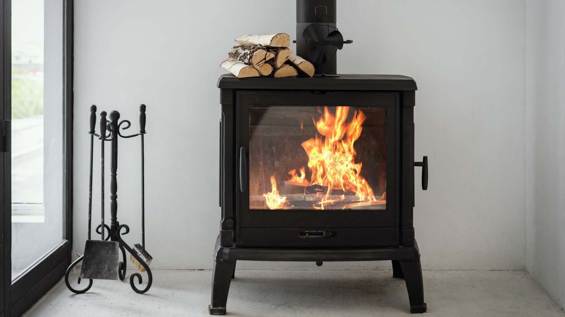 Wood burner with wood burning in a living room
