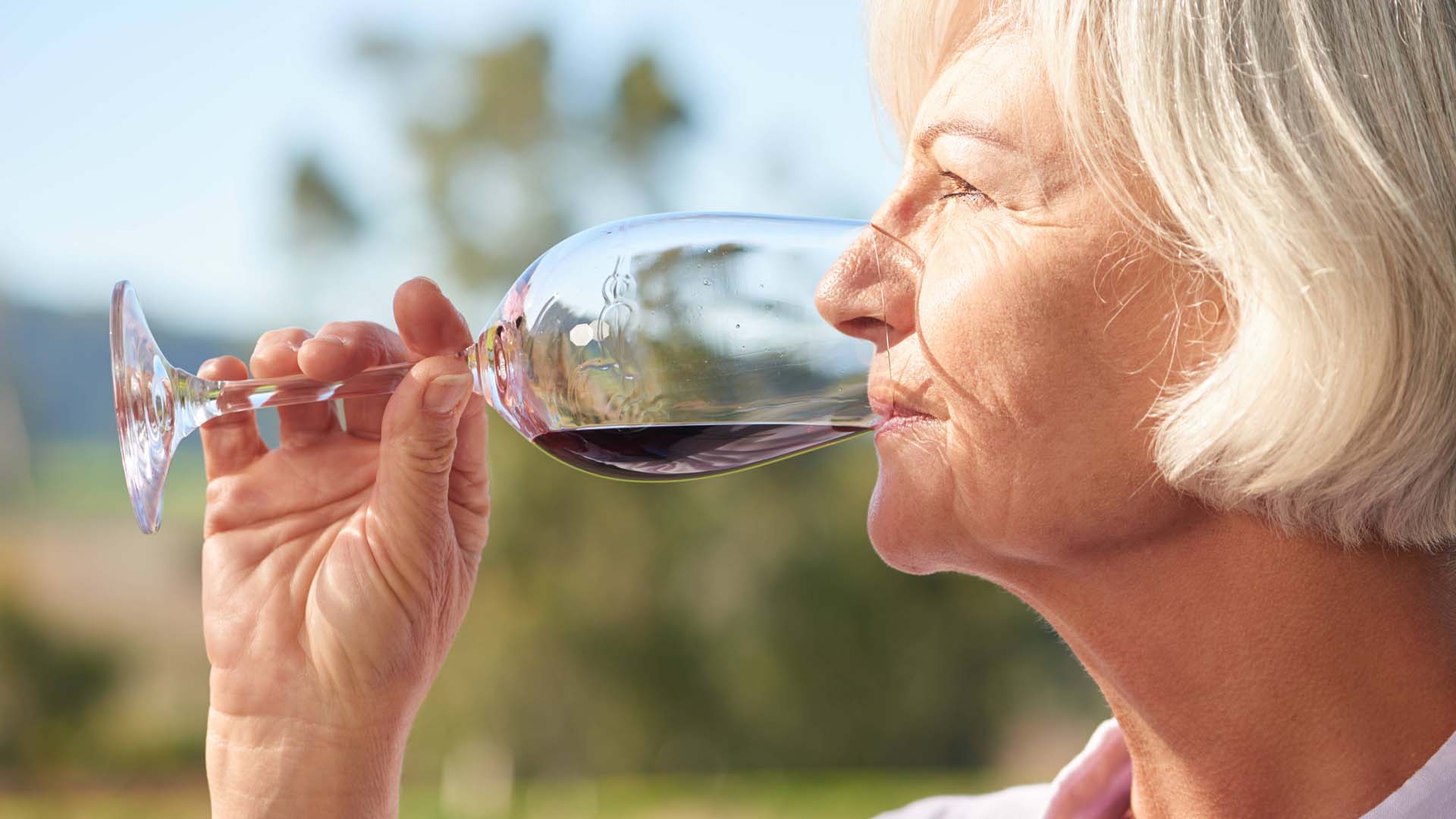 Woman drinking red wine