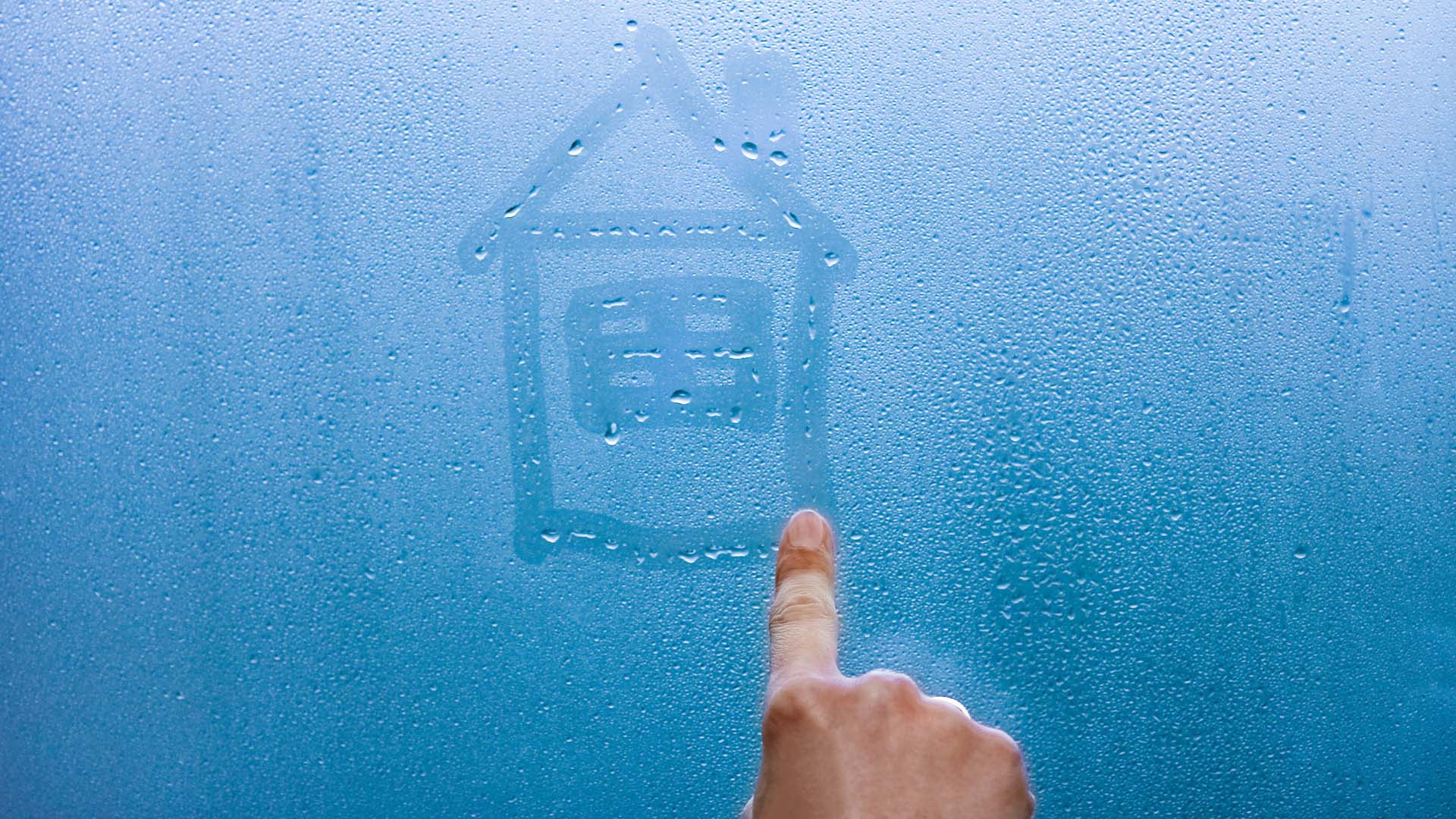 Drawing a house in the window condensation