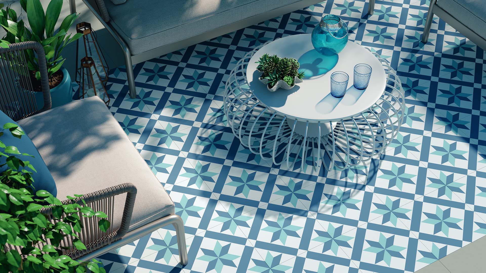 A courtyard with blue and white patterned tiles on the floor