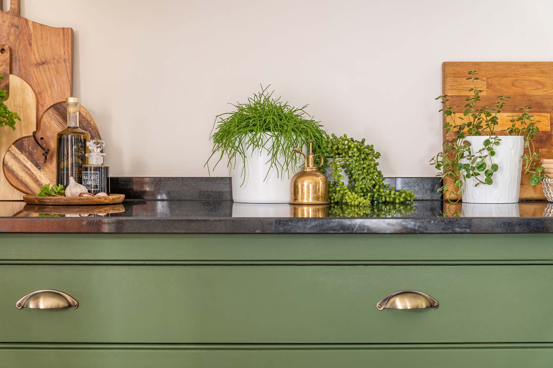 Freshly painted green kitchen cabinets