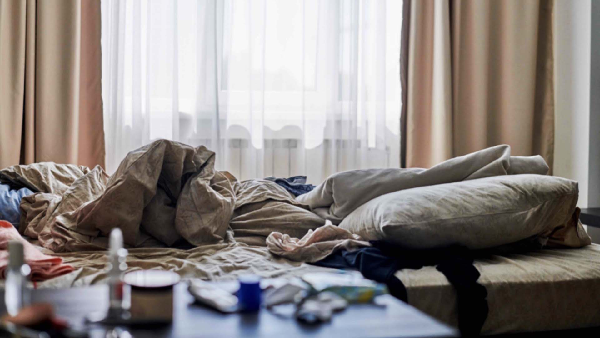 Unmade bed in a room