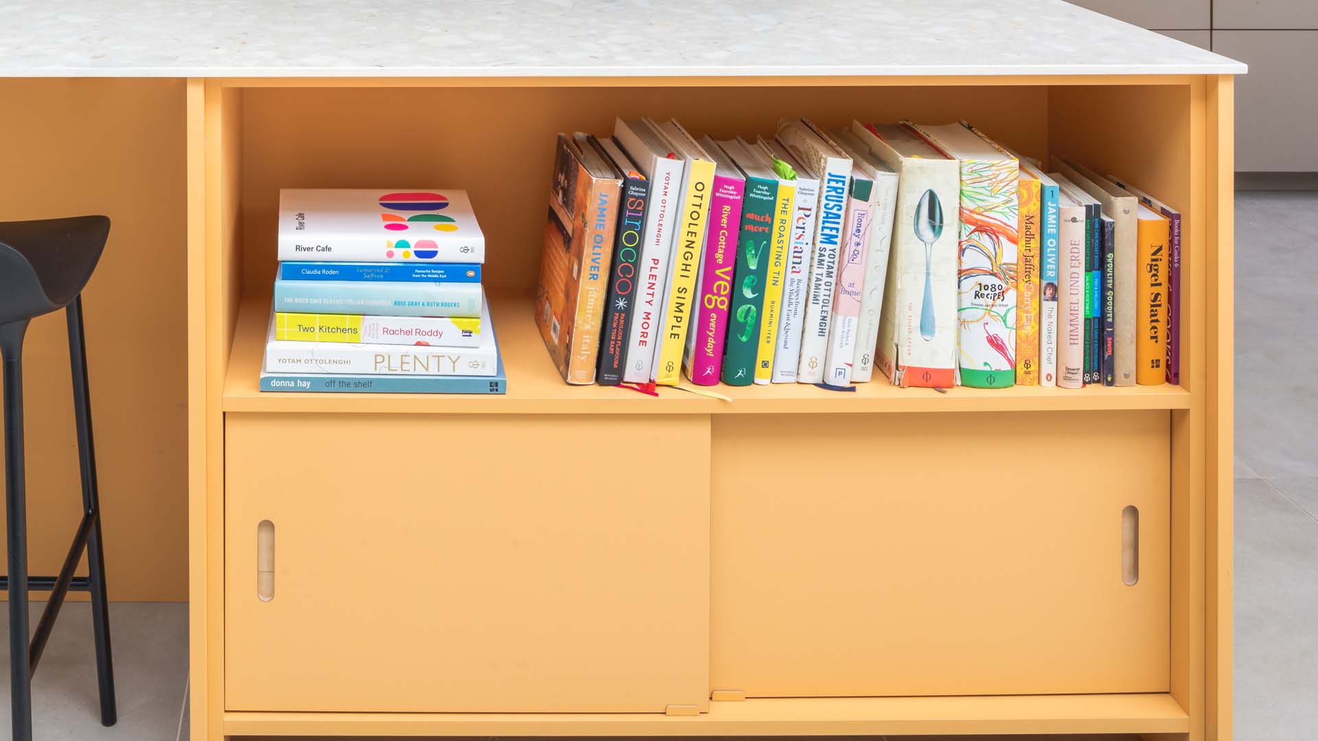 Only keep the cookery books you use on a regular basis. Otherwise, photograph recipes you love, then give the books away to charity.