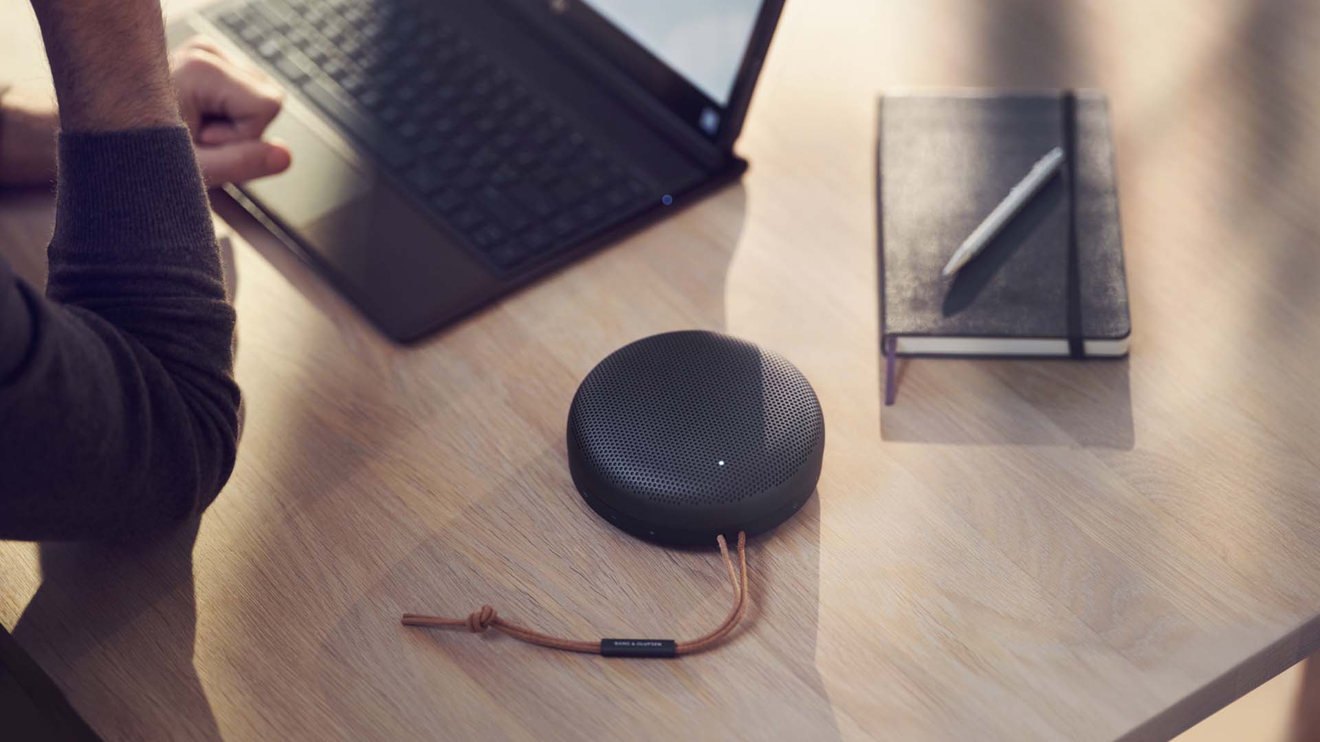 smart speaker next to a laptop