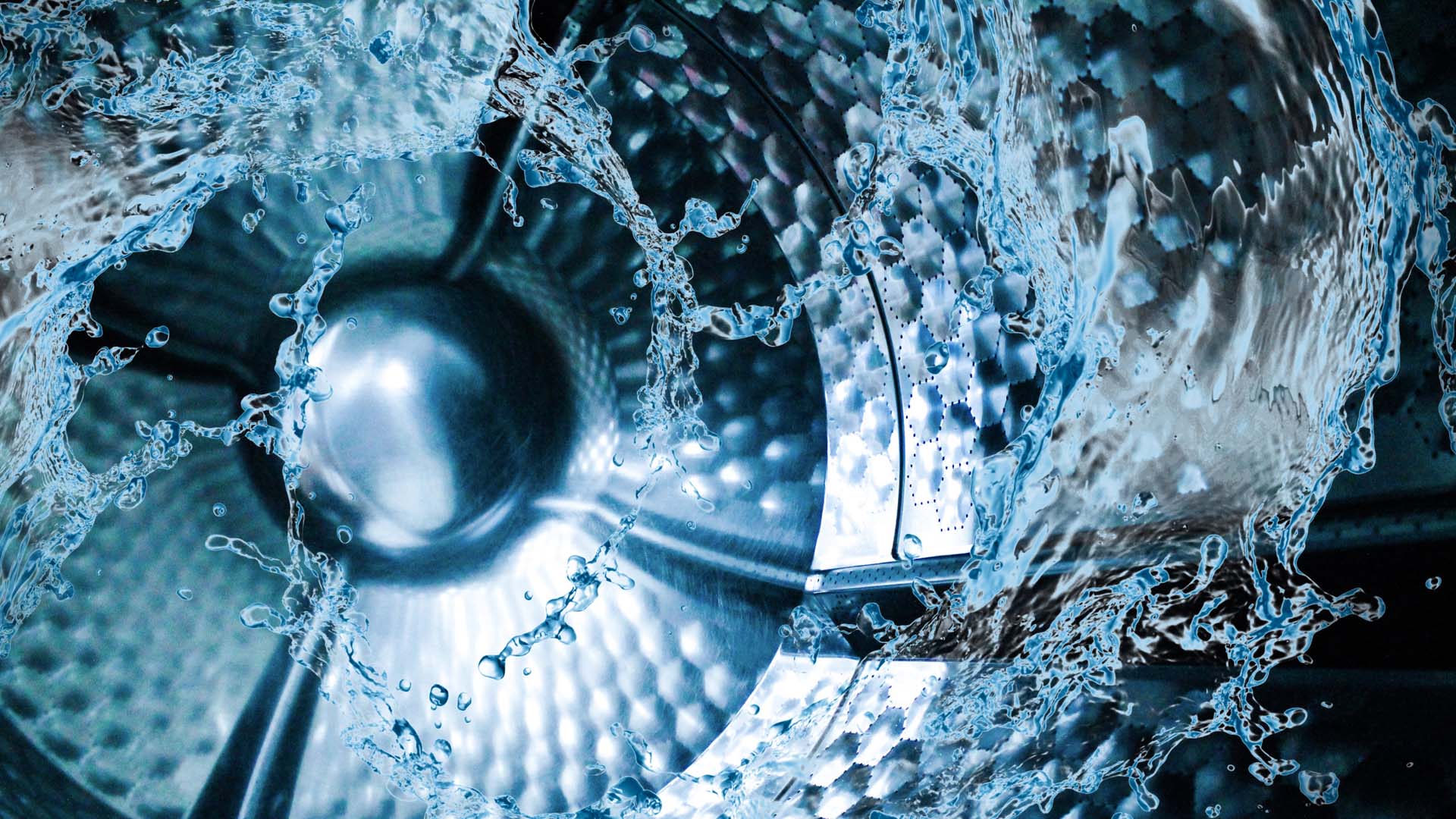 inside of washing machine drum in motion with water