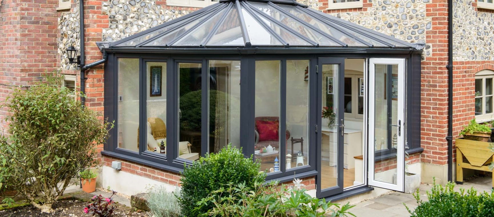 A conservatory with a reflective roof to repel heat