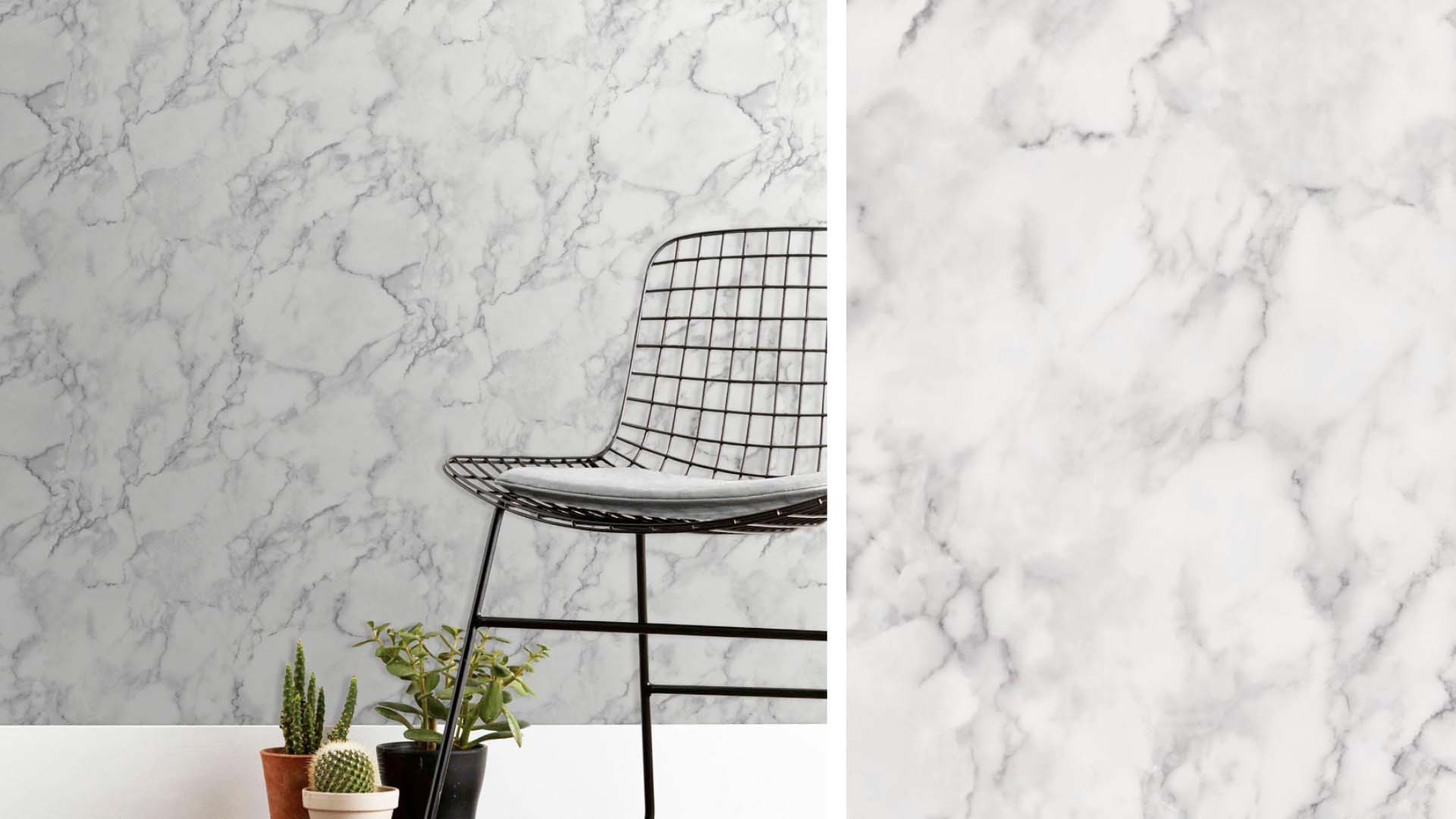 A chair with a marble effect wall behind it