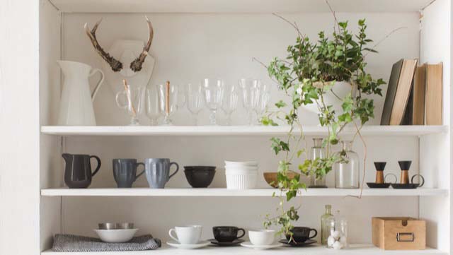 White kitchen cabinet or cupboard for dishes with copy space