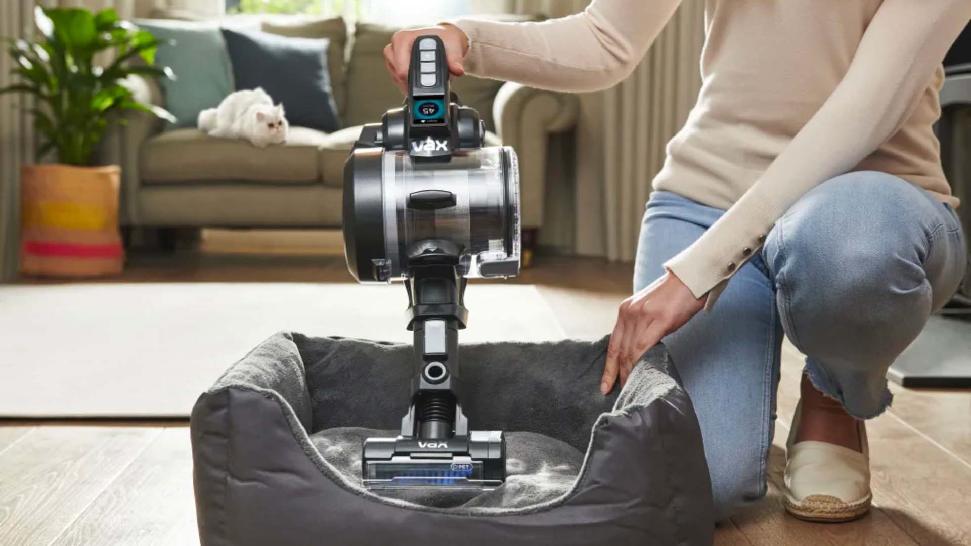 vacuuming a pet bed with the Vax 