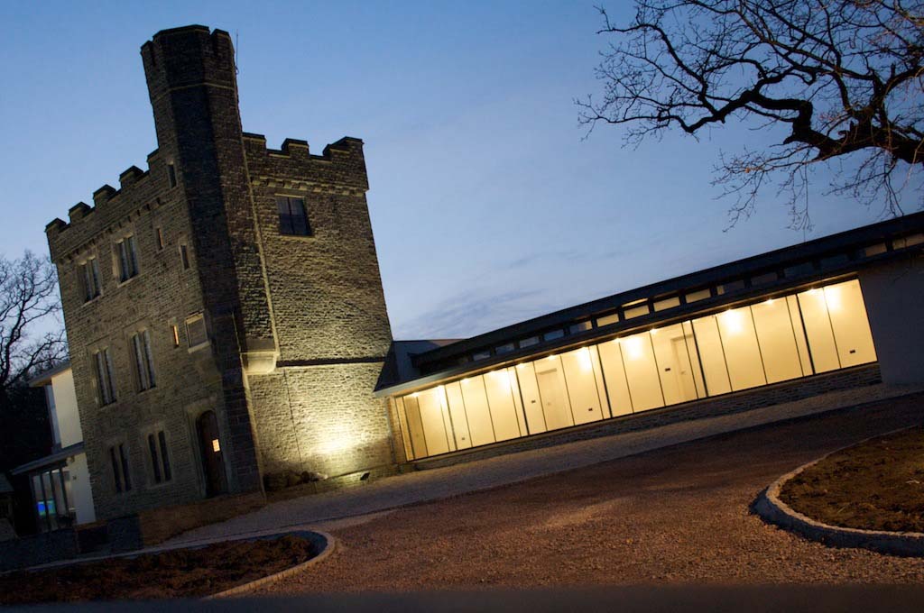 A lit up house at dusk