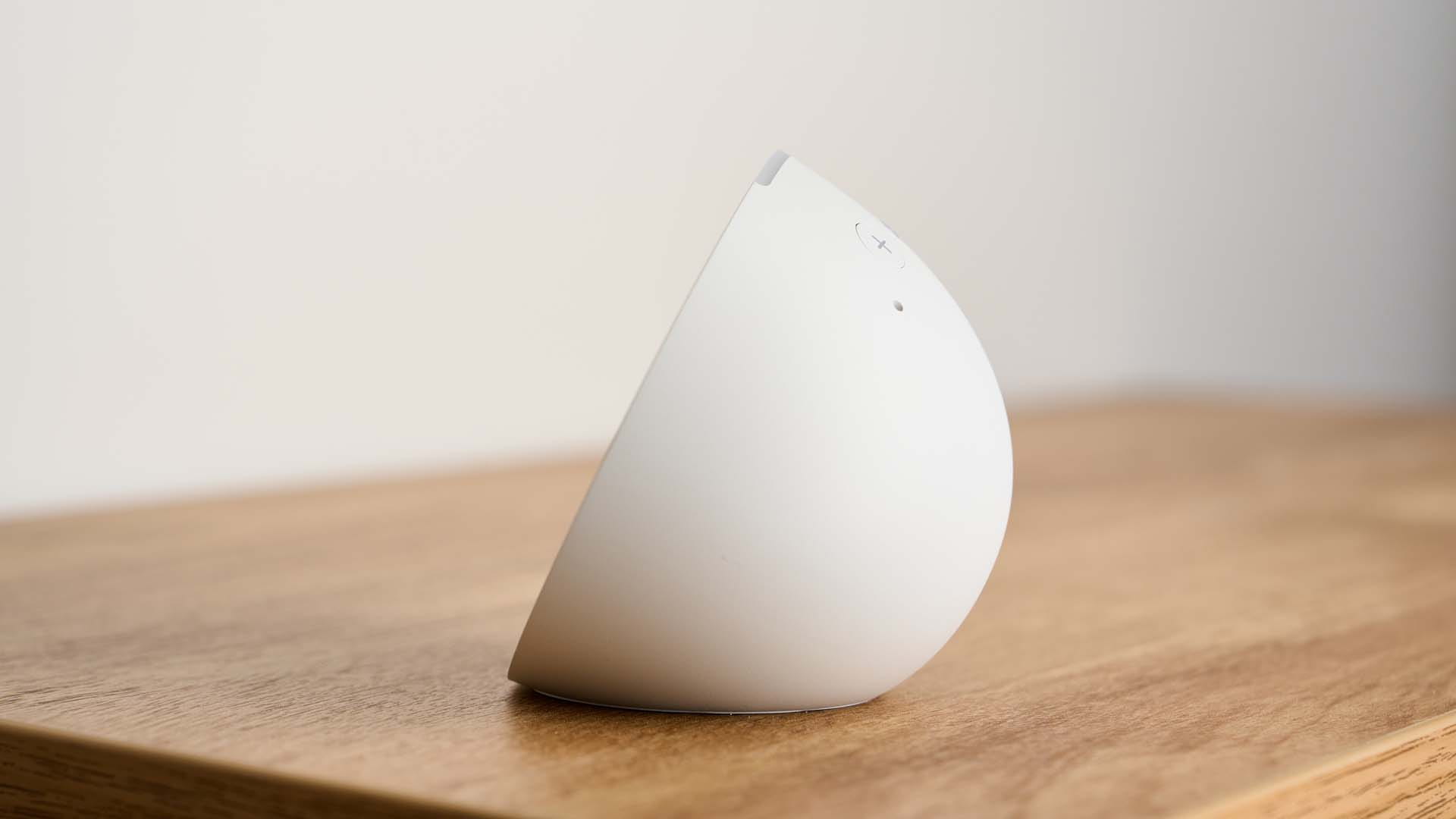 side of an Amazon Echo Pop on a table