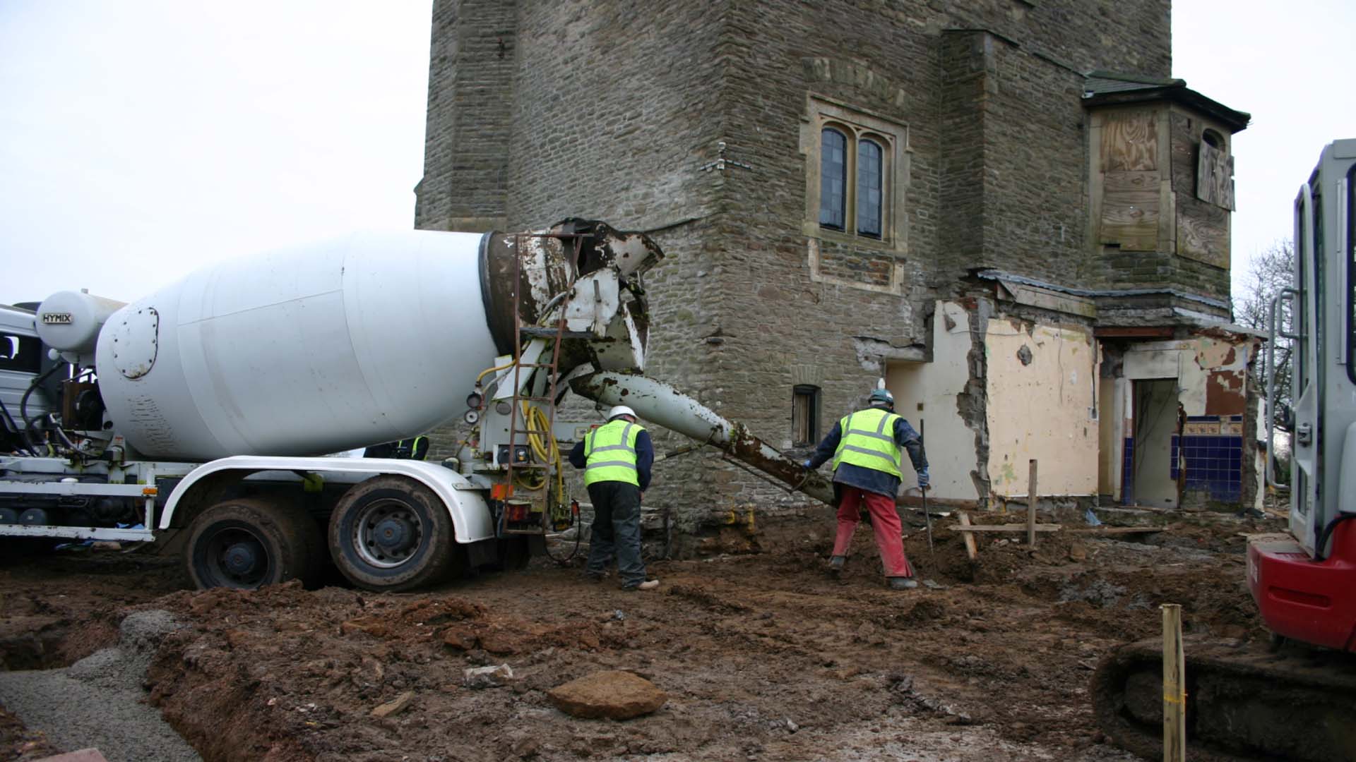 A concrete pourer pouring concrete