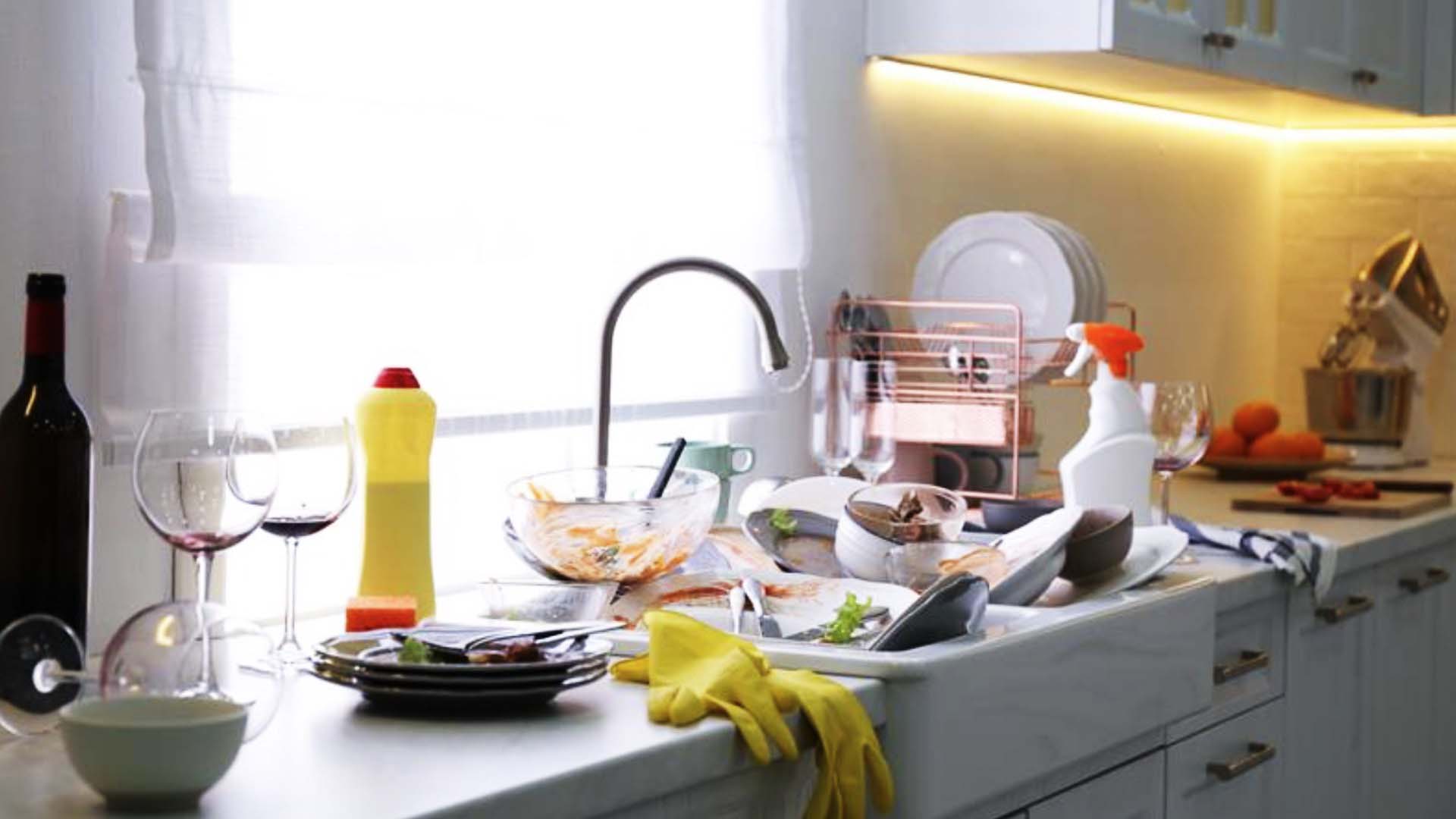 A sink full of dishes to be washed