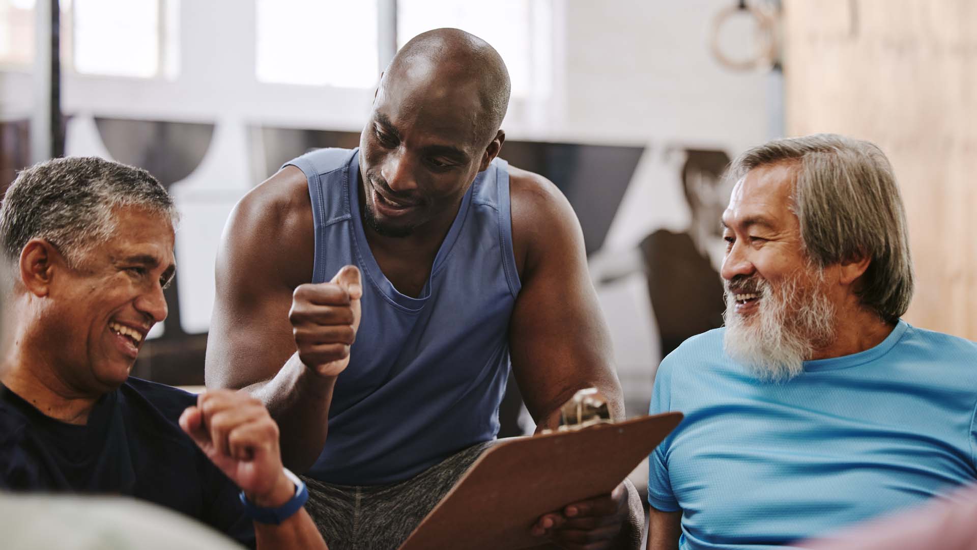 Personal trainer motivating mature clients