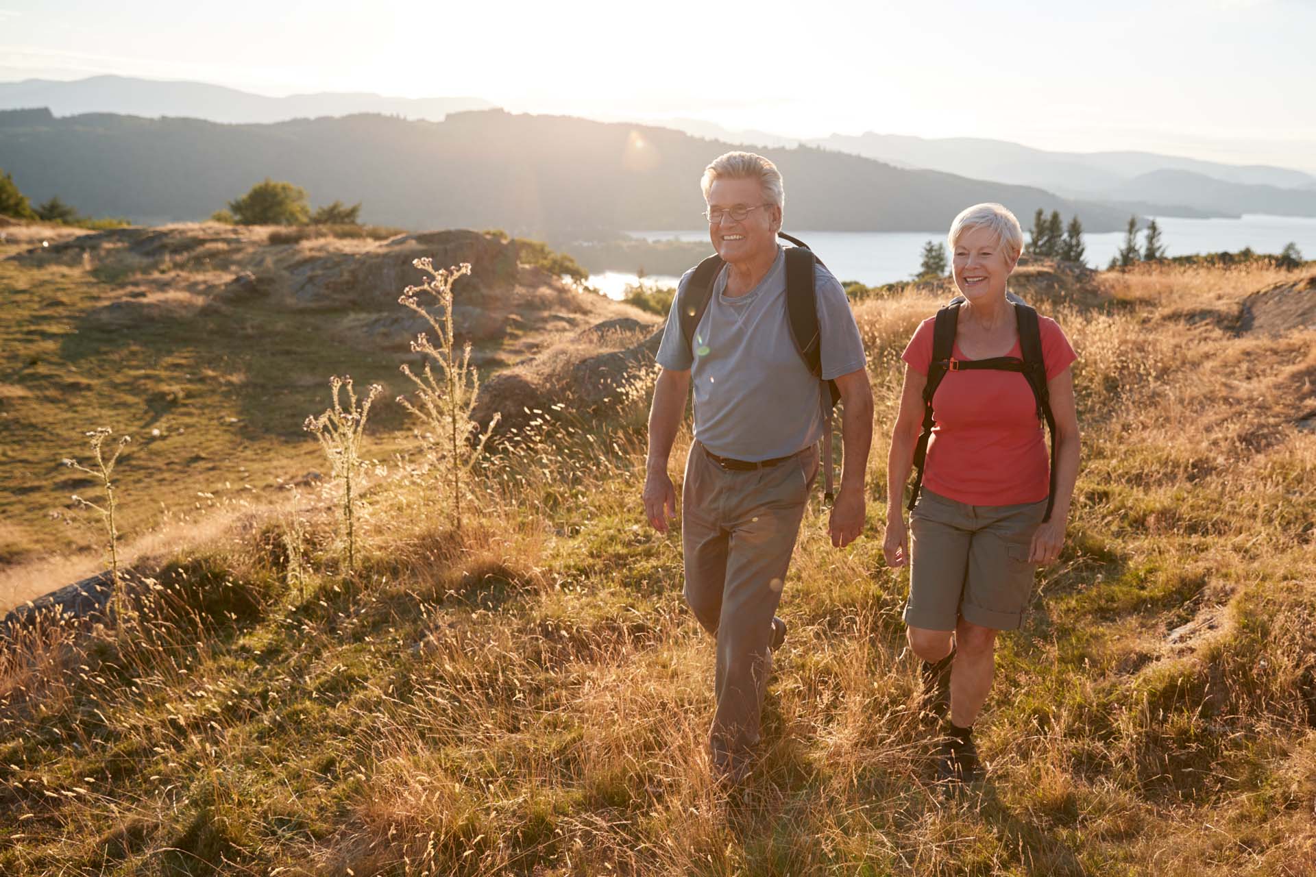 A couple on a hike with a beautiful scenic backdrop
