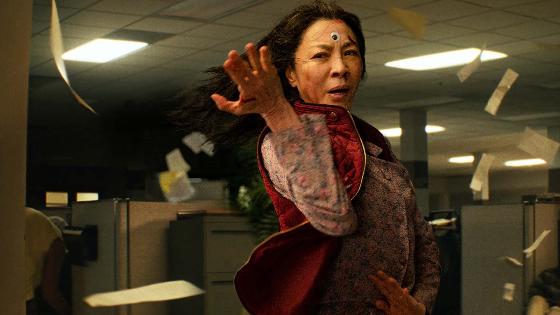 An action shot of Michelle Yeoh in the movie Everything Everywhere All At Once