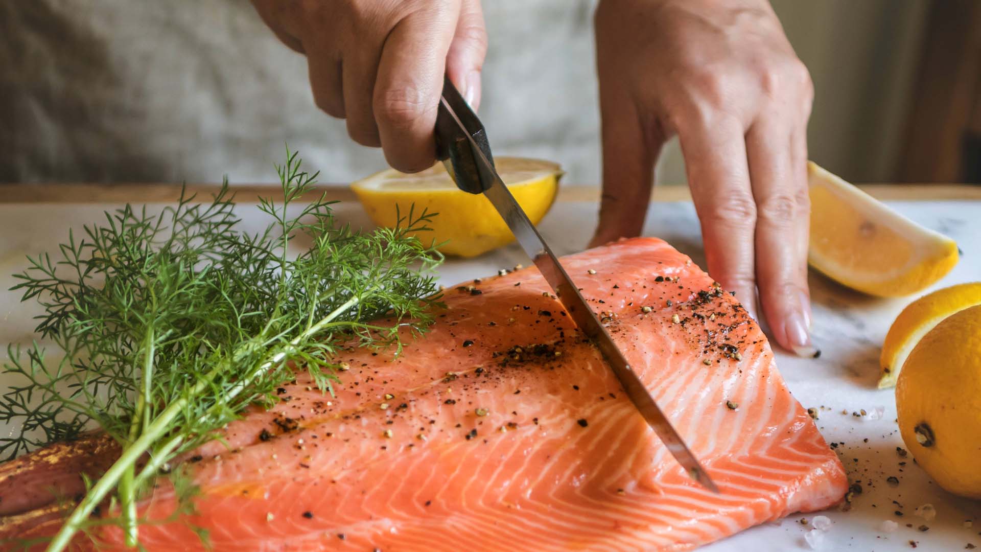 Salmon being sliced