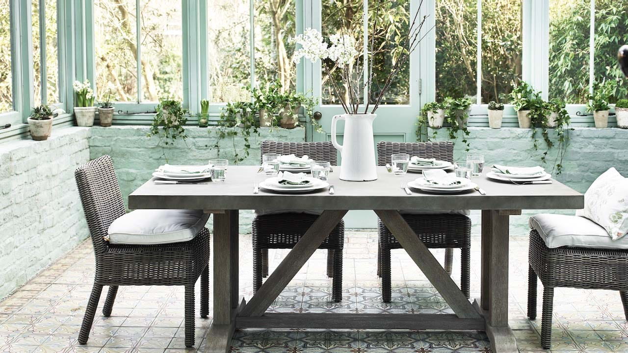 large dining room table in a conservatory