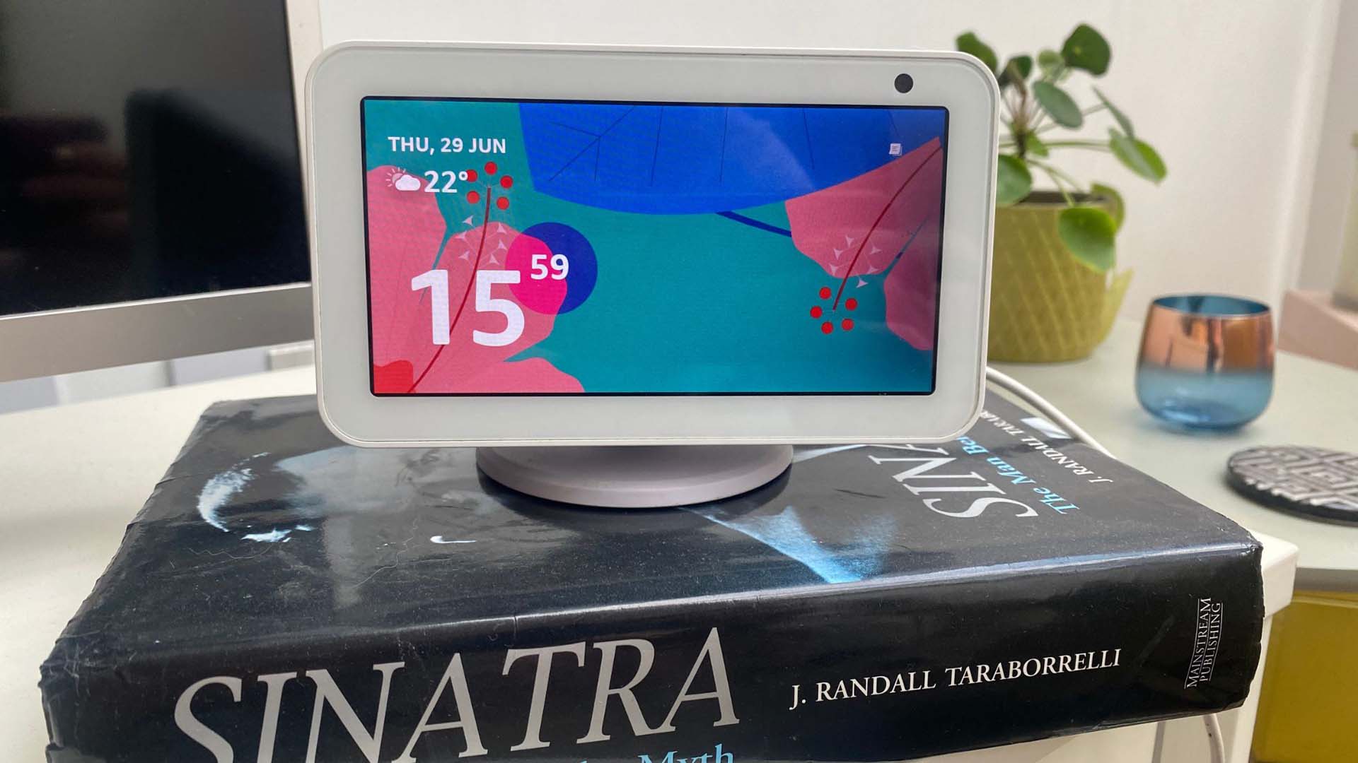 An Echo Show on top of a book