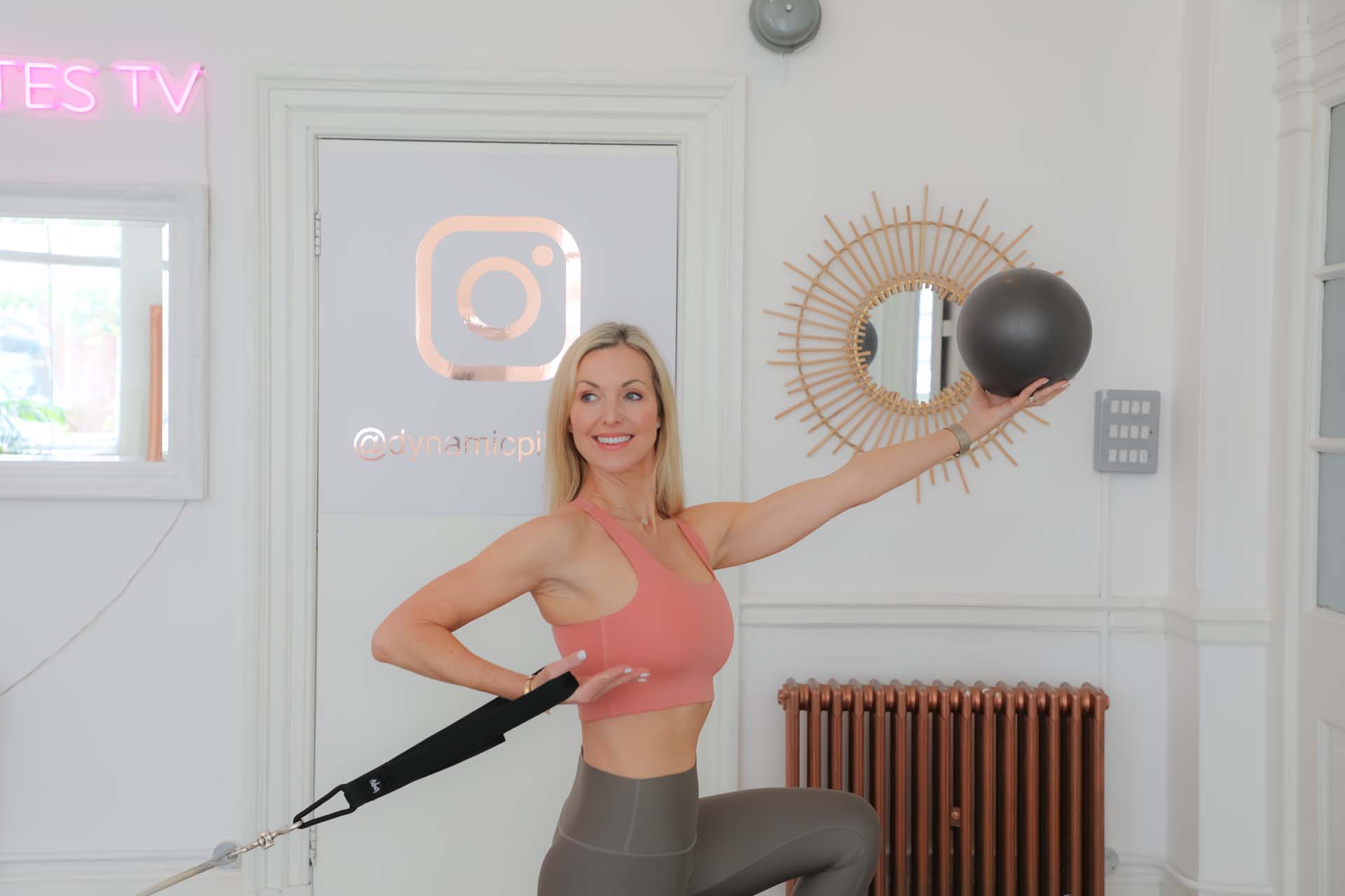 A woman with Pilates equipment