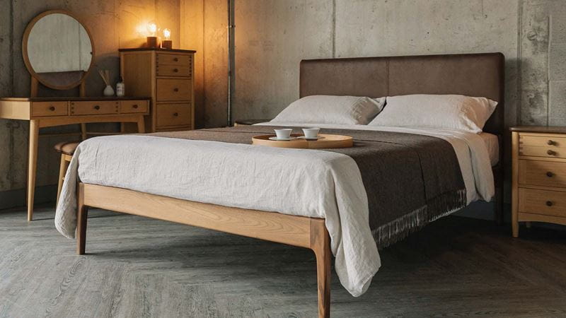 Bed with space underneath and neutral decoration