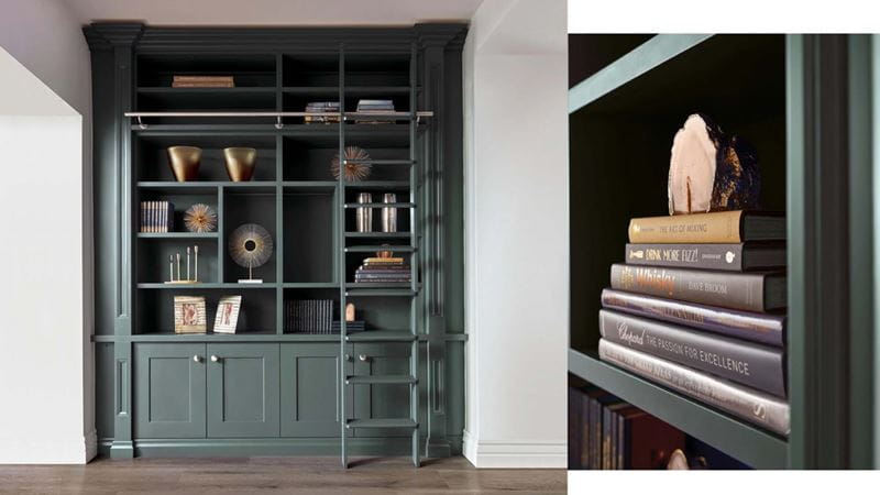 gorgeous green bespoke built bookshelf with a ladder