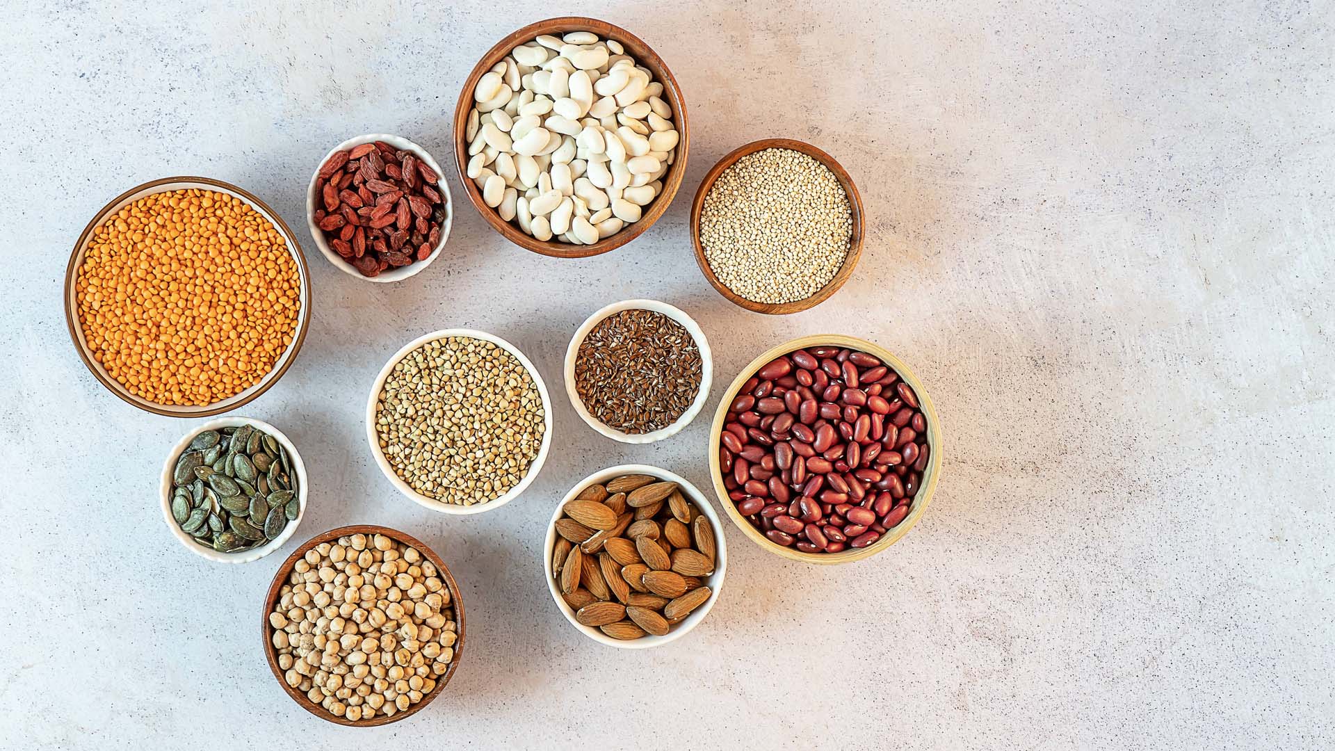 Small bowls of protein like beans and lentils