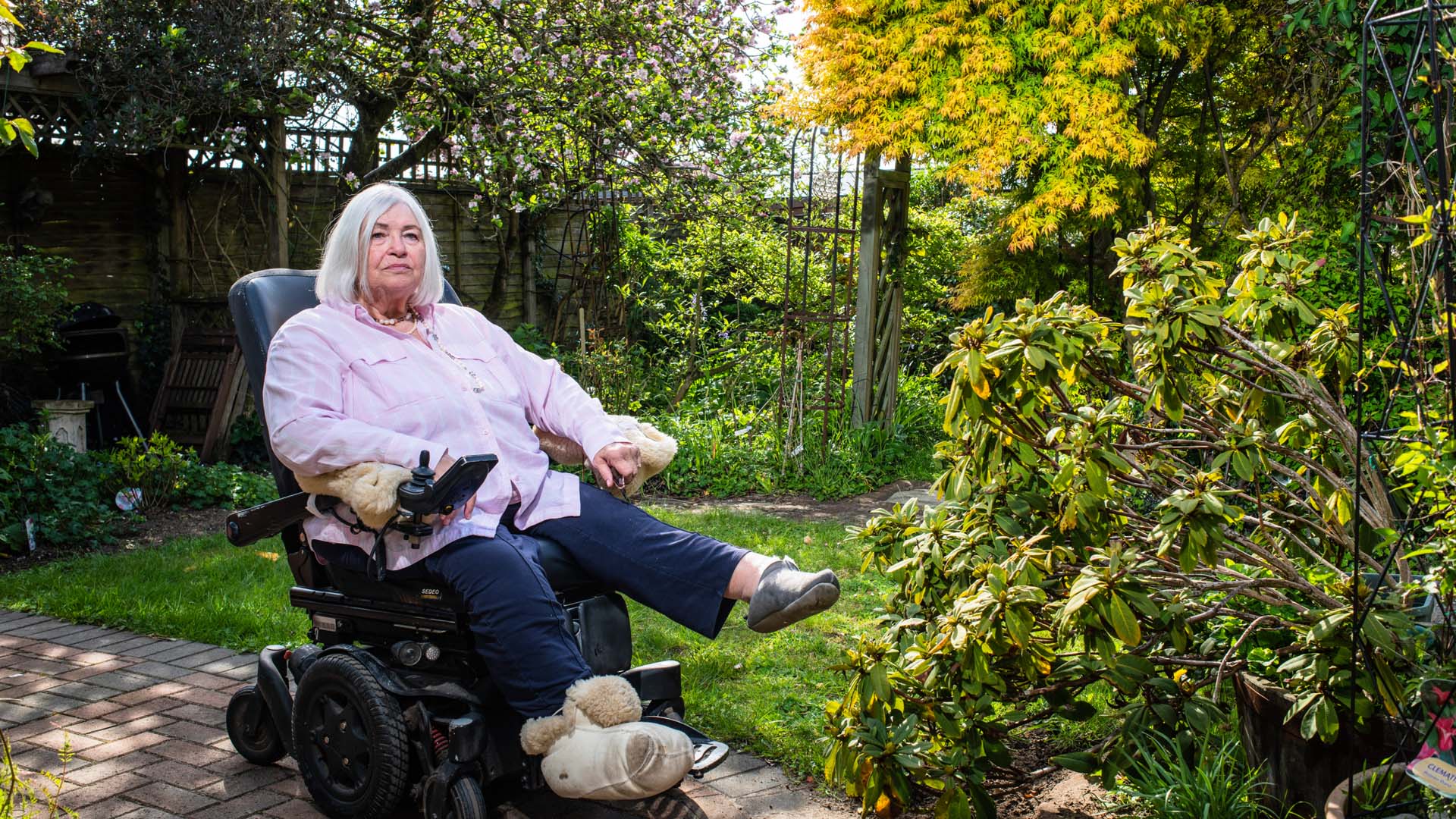 Sheila sitting in a garden