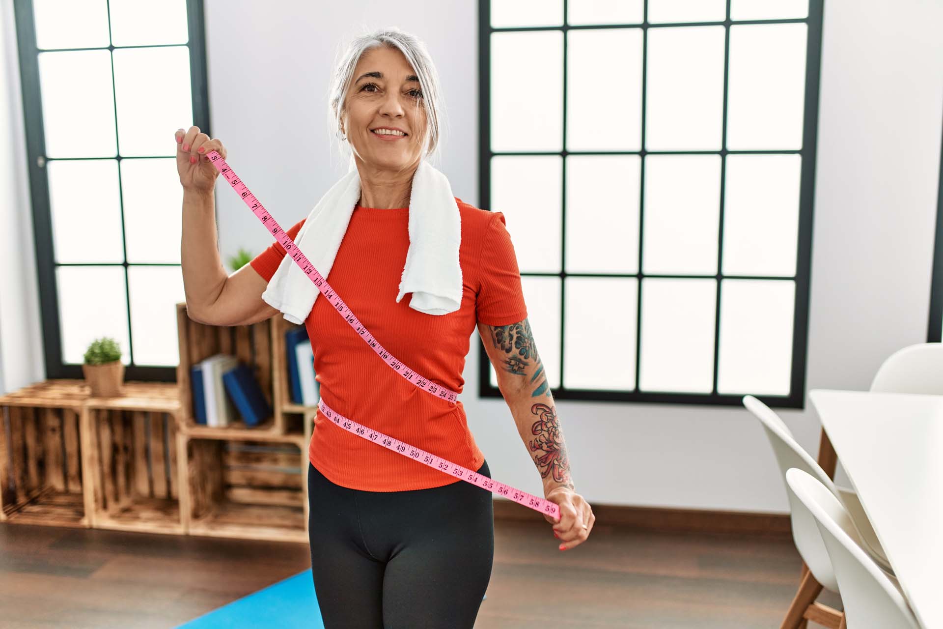 A woman with a tape measure around her