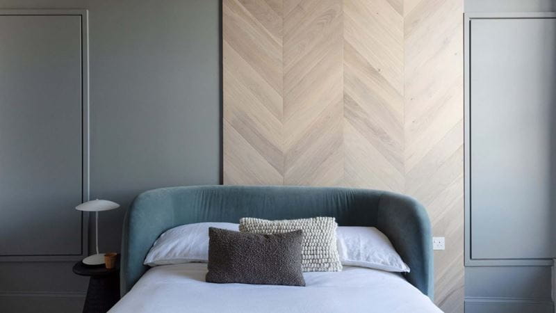 curved headboard on a small bed
