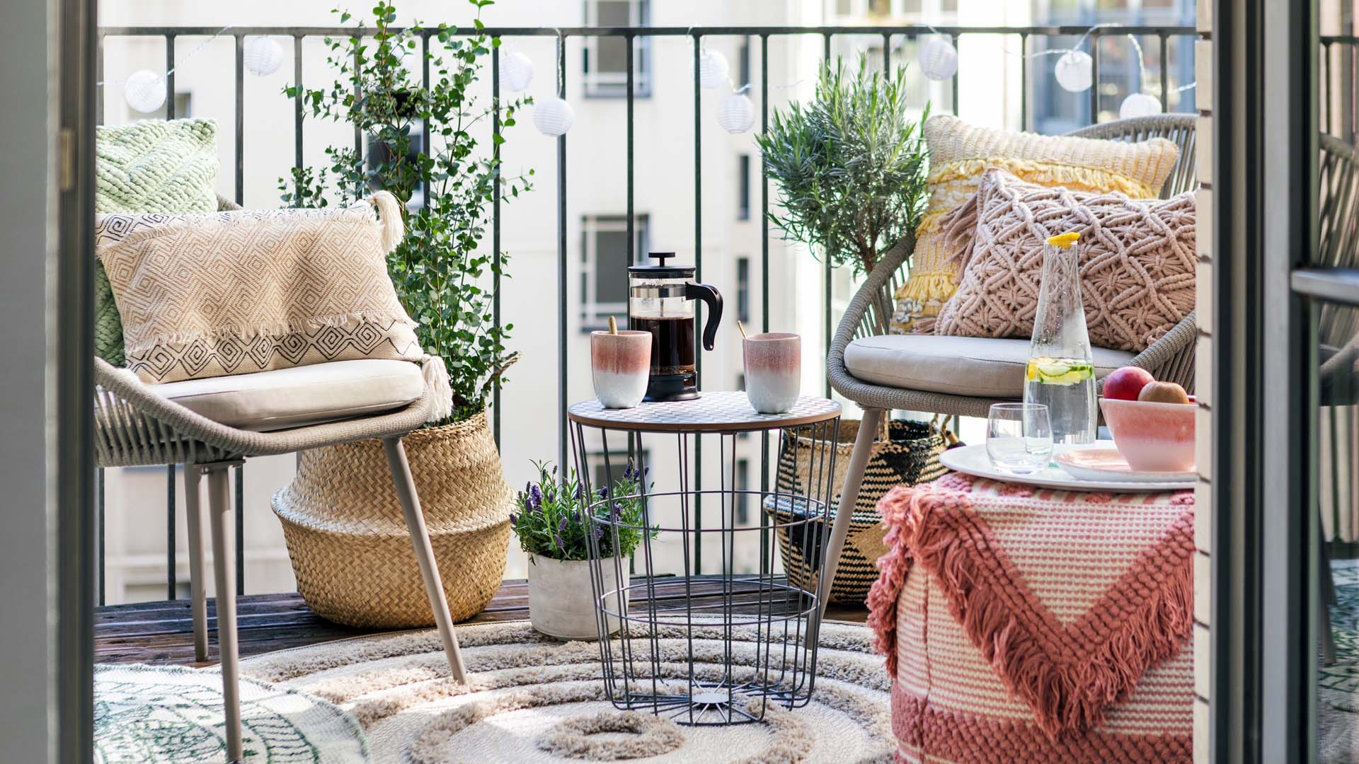 A pretty balcony with comfy chairs and coffee table