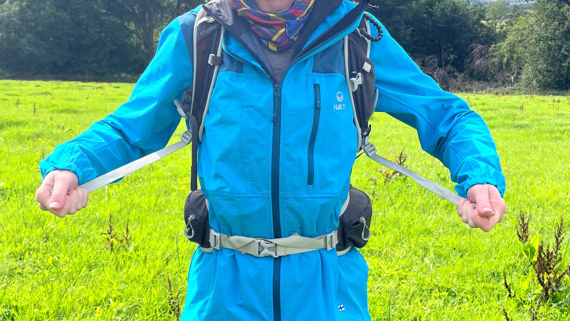 Harness straps being adjusted