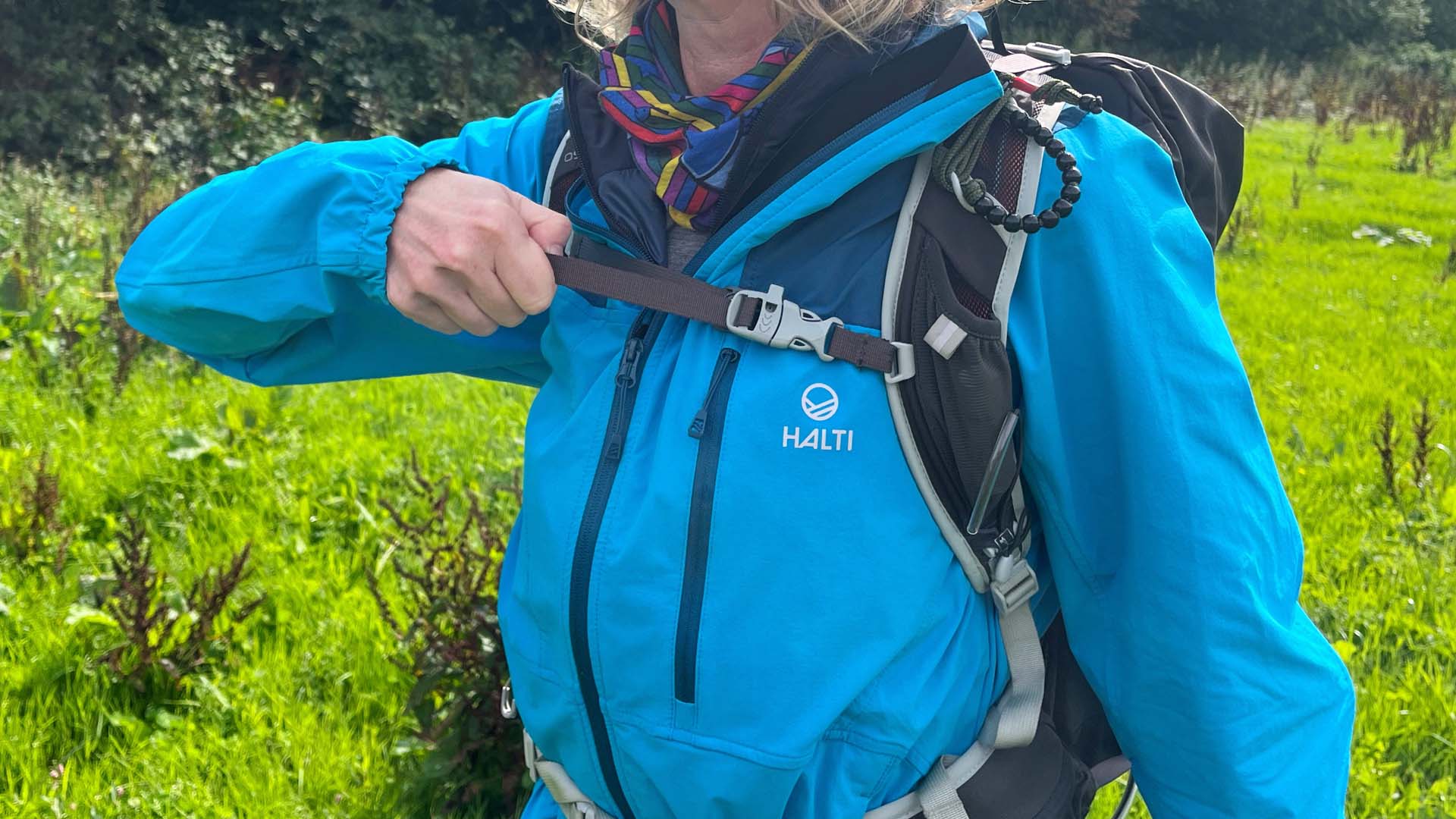 The sternum strap being adjusted