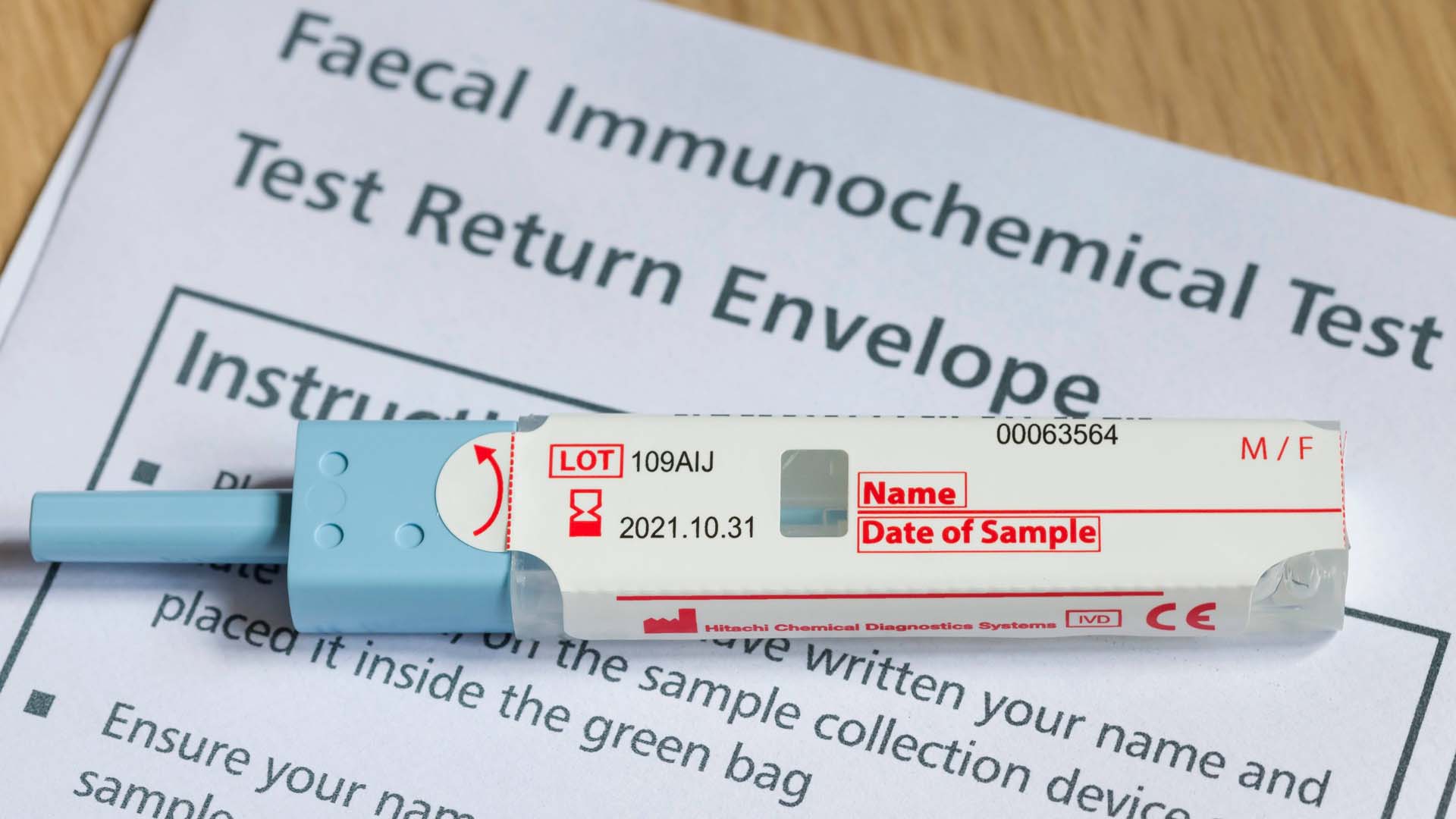 the actual bowel cancer test kit with documents