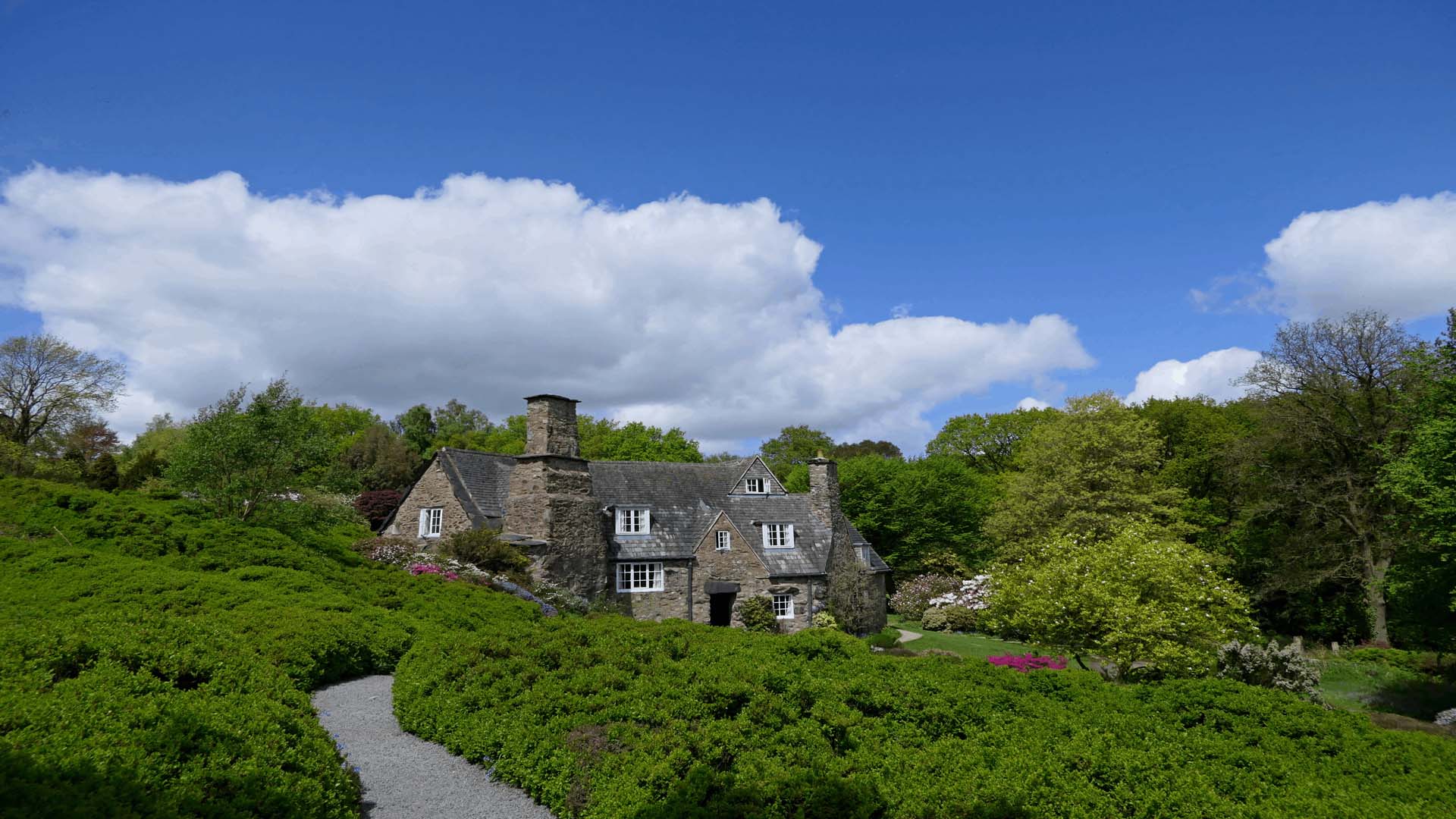 Stoneywell cottage, an Arts and Crafts home, is nestled into a hilly garden