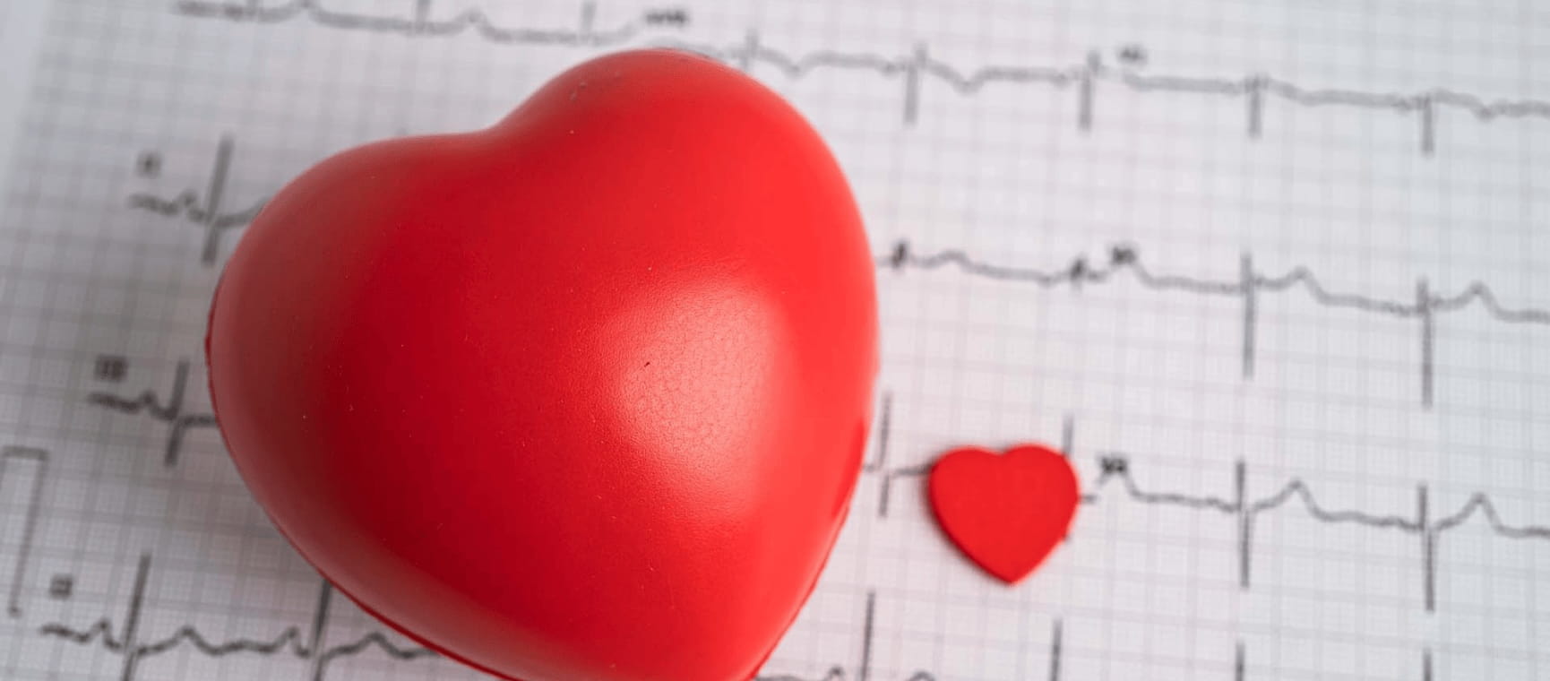 A heart in front of a cardio graph