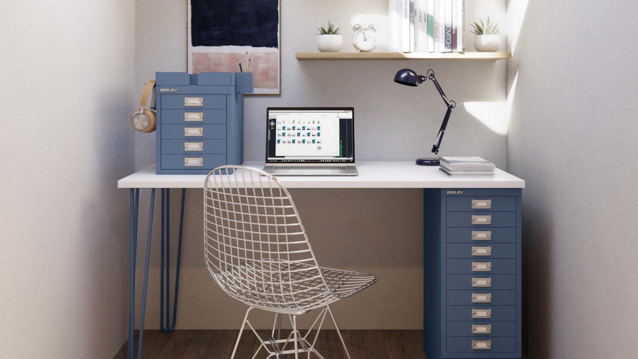 Blue desk against cream wall