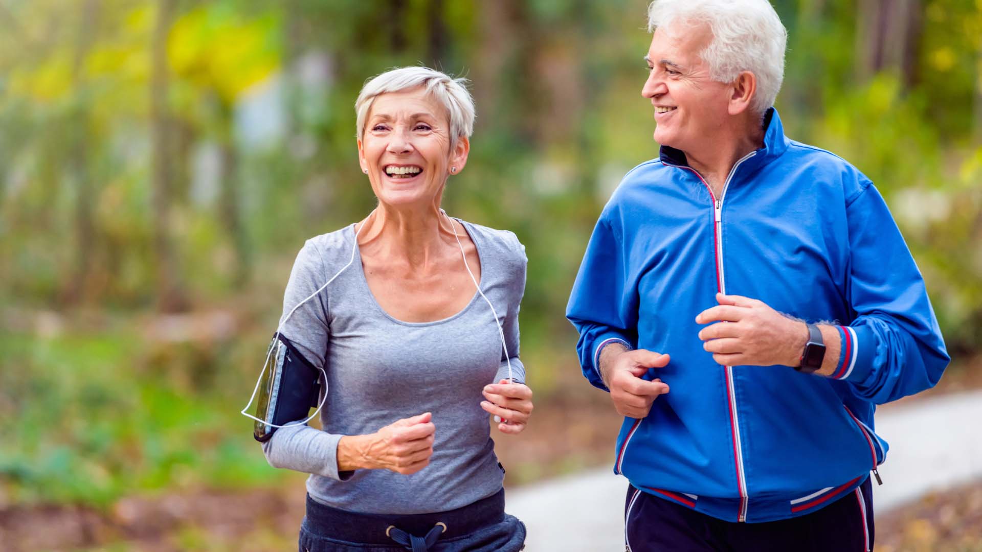 a mature man and woman together on a run