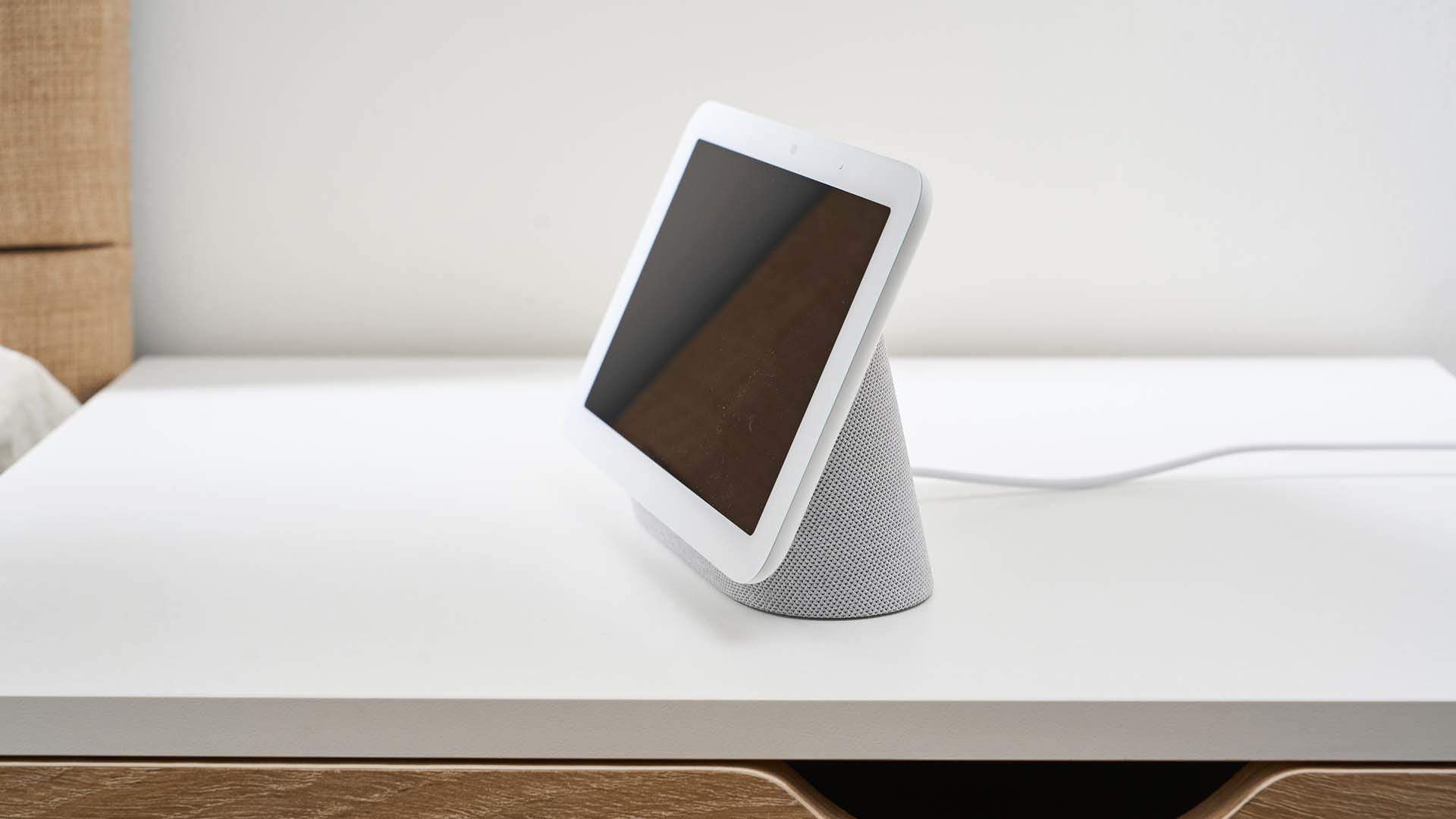 Side view of the Google Nest Hub on a bedside table