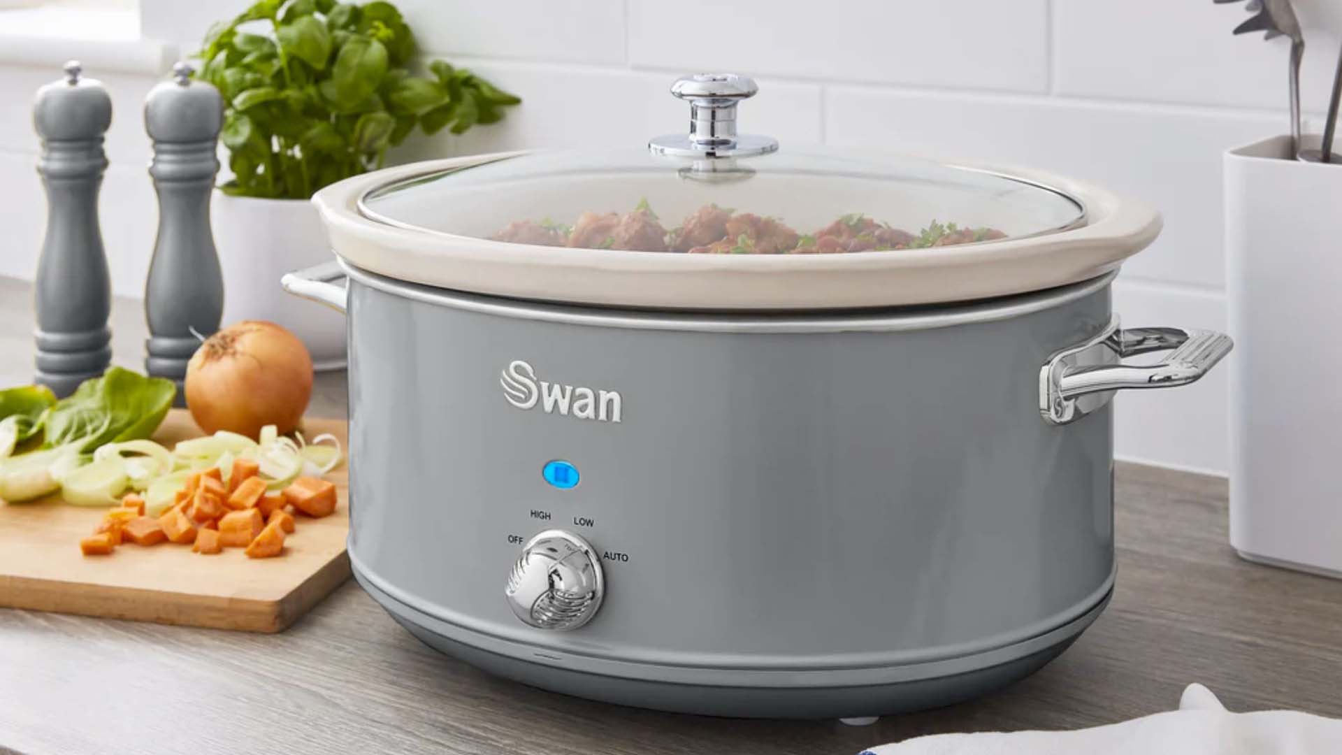 A grey slow cooker on a kitchen counter