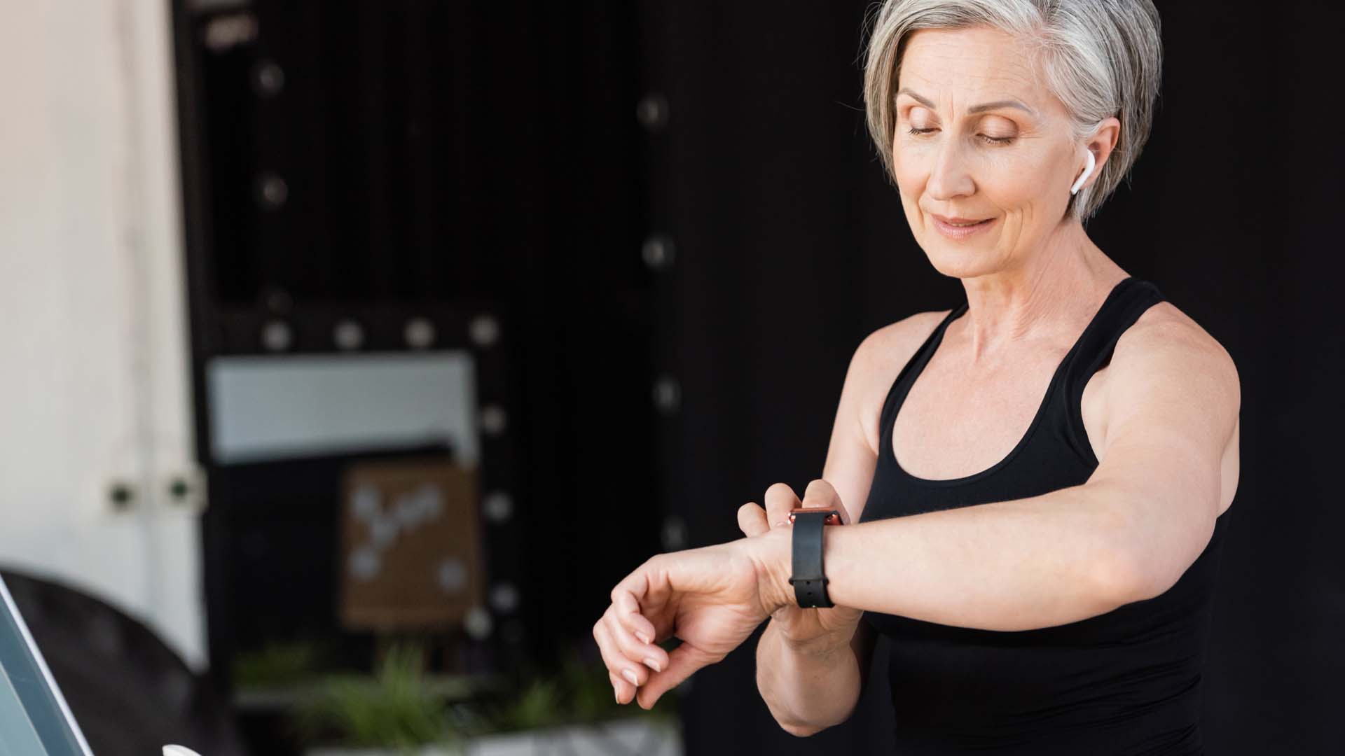 Woman checking a fitness tracker