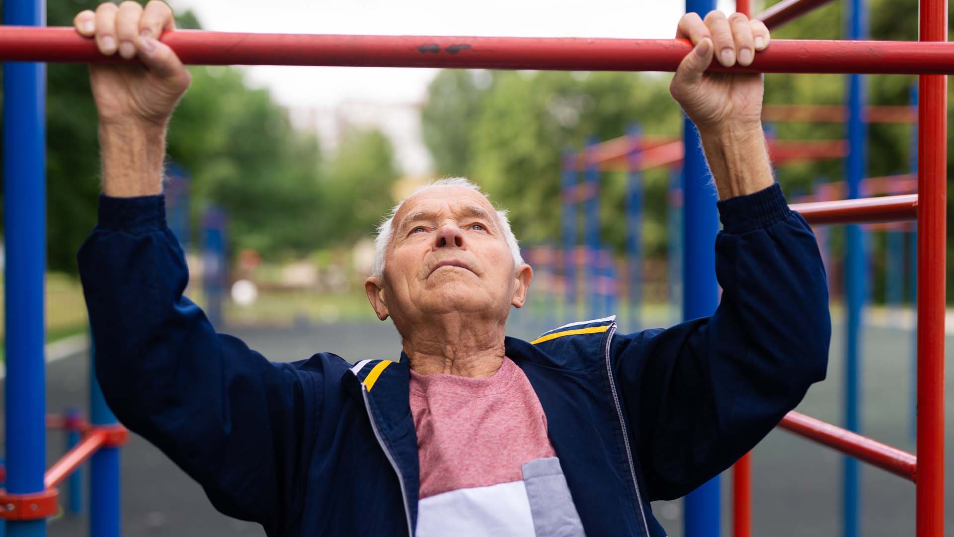 man pulling up on a bar