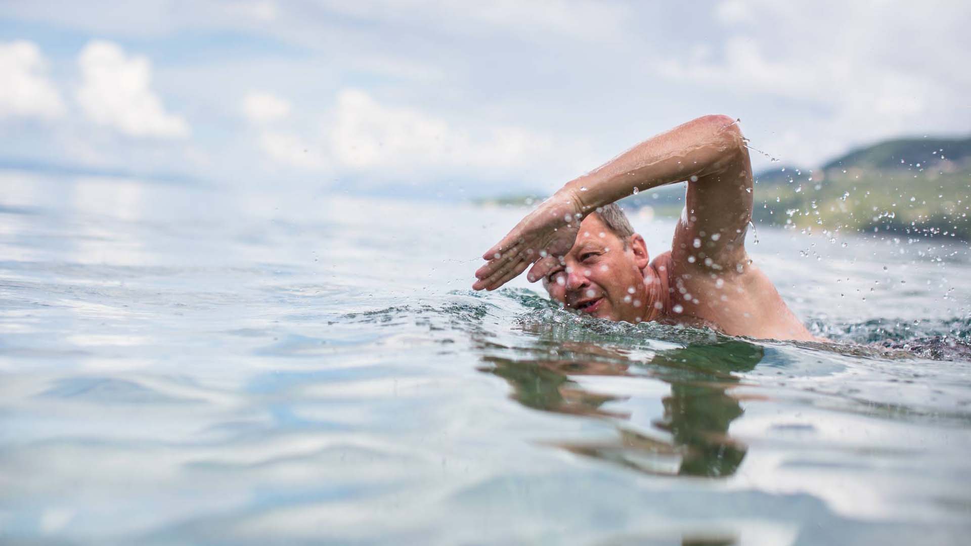Man swimming in a lake