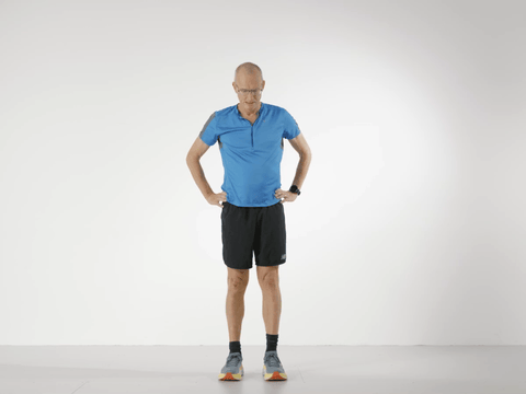 Paul balancing on one leg before touching his toes